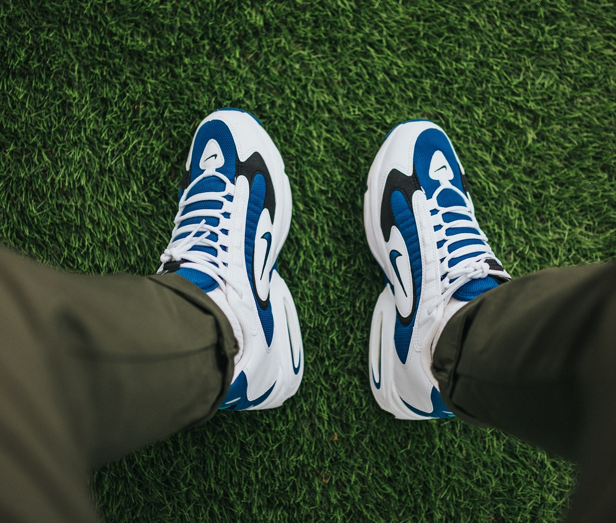 Shoes walking on freshly laid sod