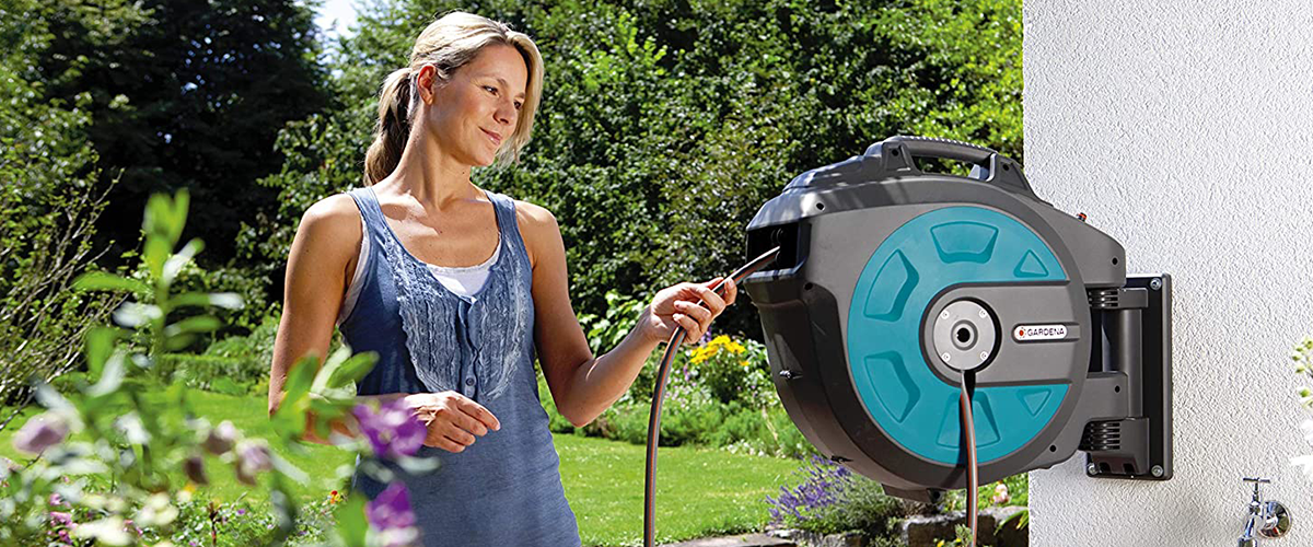 Women in garden using the Gardena Auto Hose Reel