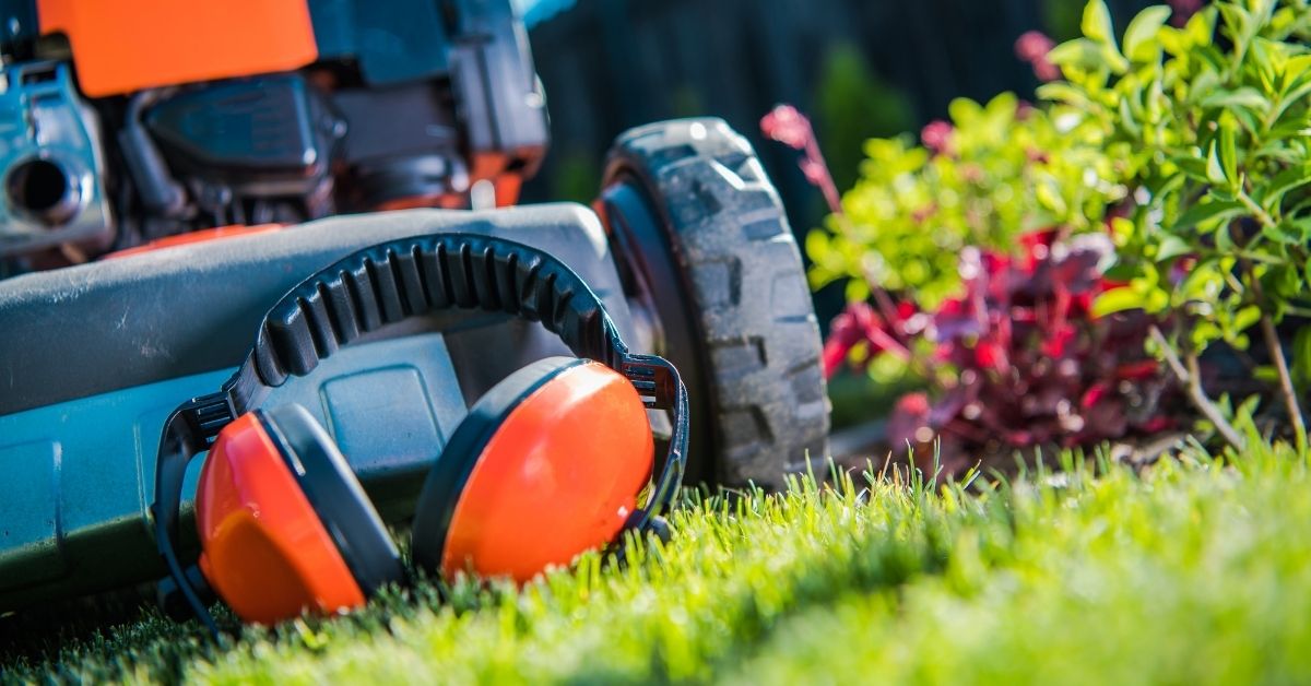 Landscaping Headphones near a lawnmower